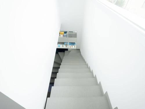 a stairway in a white room with a white wall at Villa Timpi Rossi Total Relax in Alcamo