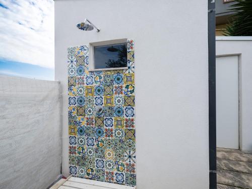 a mosaic door with a window on a house at Villa Timpi Rossi Total Relax in Alcamo