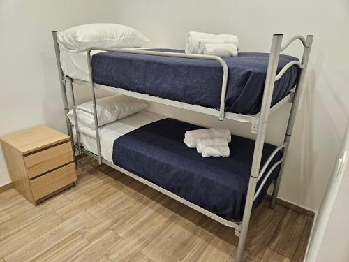 a couple of bunk beds in a room at Profumi di Sicilia in Cinisi