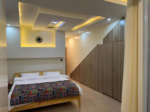 a bedroom with a bed in a room at Live Well Rwanda House in Kigali