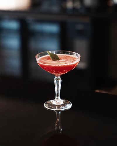 a cocktail in a glass on a table at Westotel Taverny - Paris Val-d'Oise in Taverny