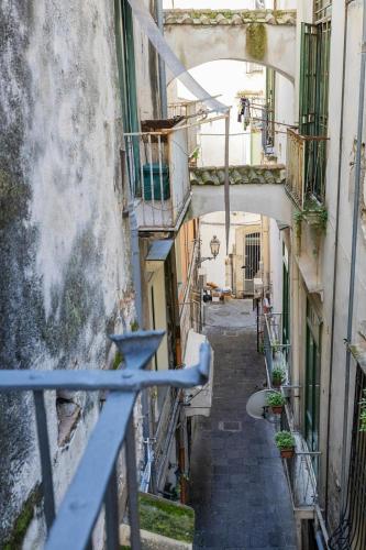 a view of an alley from a balcony of a building at B & B Boutique Epoca in Salerno