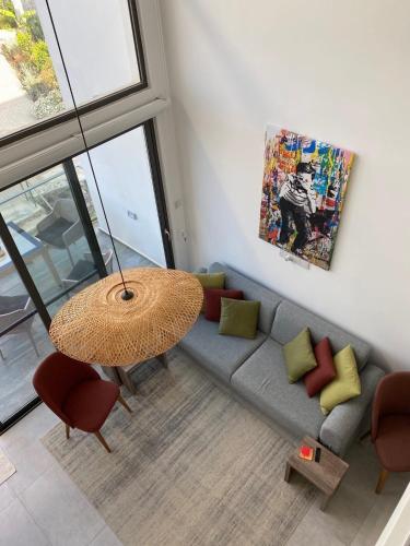a living room with a couch and a table at Retreat, block B1, unit15 in Küçükerenköy