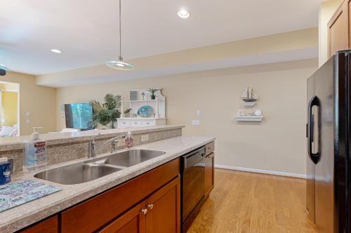 a kitchen with a sink and a refrigerator at Bayville Shores --- 35729 Coleman Ave in Selbyville
