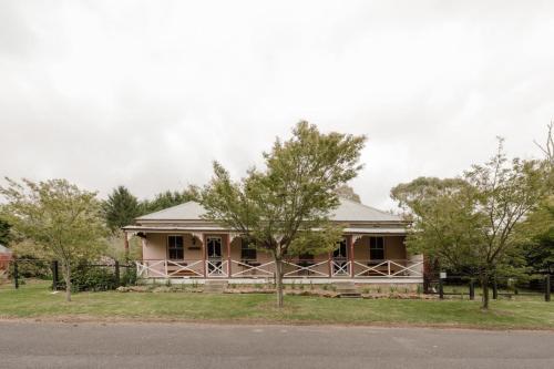 a house on the side of a road at Larsens Cottage 2 - Historic 1880 Home in Mount Victoria