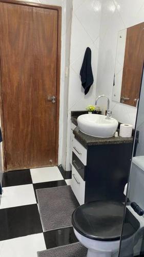 a bathroom with a toilet and a sink at Ap da Auri in Petrolina