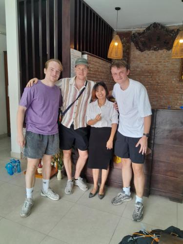 a group of four people posing for a picture at B'Lan Riverside Villa in Hoi An