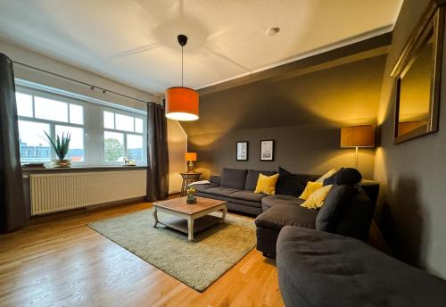 a living room with a couch and a table at Villa Herzog in Bad Sooden-Allendorf