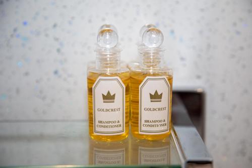two bottles of oil sitting on top of a table at Glebe Street Apartment in Fife