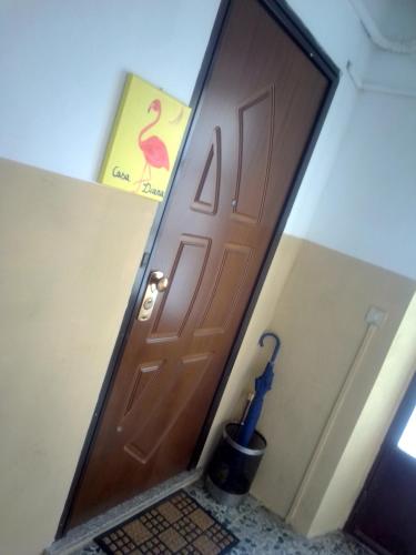 a door in a room with a flamingo sign at Casa diana in Venaria Reale