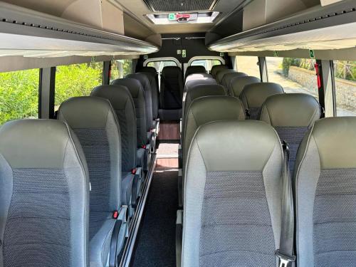 an empty bus with empty seats on a bus at Hostel & Glamping Santa Fortunata in Sorrento