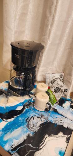 a blender sitting on top of a table at Santorini Suites Cozumel in Cozumel