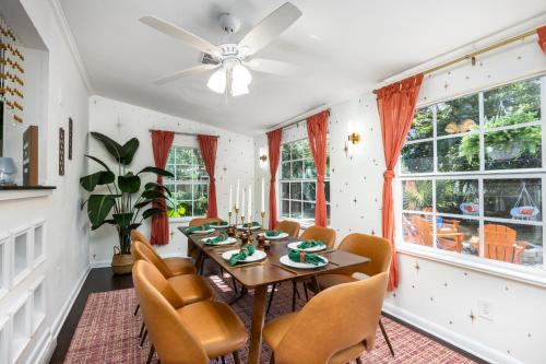 a dining room with a table and chairs at 4bd Gator Grove Villa - Backyard - Games - Near UF in Gainesville