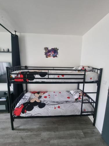 Cama o camas de una habitación en Studio à 2 pas de Disneyland