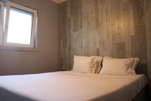 Ένα ή περισσότερα κρεβάτια σε δωμάτιο στο Oportocean Suites