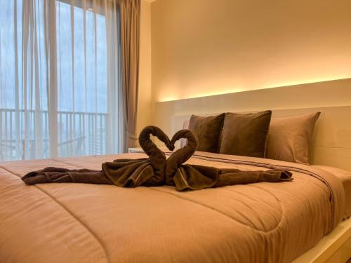 Letto o letti in una camera di The Astra Luxury Condo in Town