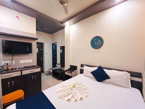 Ένα ή περισσότερα κρεβάτια σε δωμάτιο στο Kristi Guest House, Shantiniketan