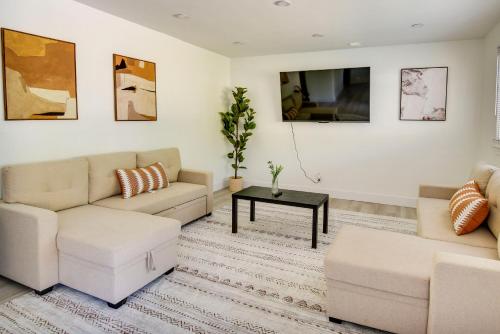 a living room with a couch and a table at Pet-Friendly Norfolk Retreat about 7 Mi to Beach! in Virginia Beach