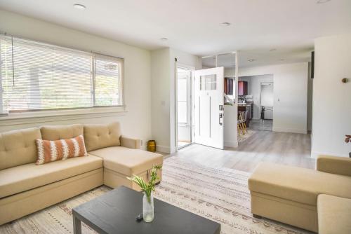 a living room with a couch and a table at Pet-Friendly Norfolk Retreat about 7 Mi to Beach! in Virginia Beach