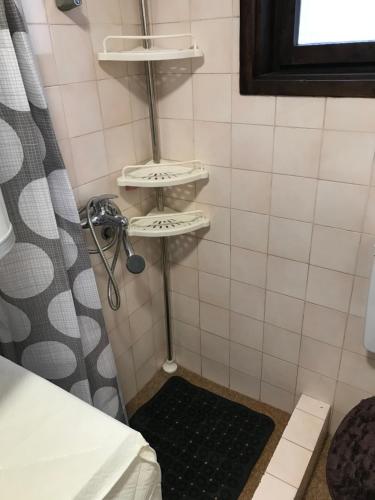 a bathroom with a shower with a shower curtain at Family escape apartment free parking in Belgrade