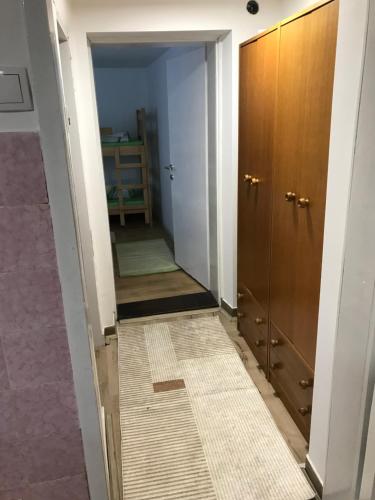 a hallway with a door and a tile floor at Family escape apartment free parking in Belgrade