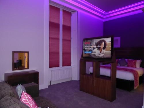 Телевизор и/или развлекательный центр в Court Residence Aparthotel
