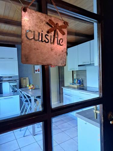a kitchen with a sign that says cuisine at Gîte al fontaine in La Roche-en-Ardenne