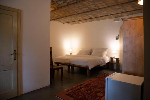 Postel nebo postele na pokoji v ubytování Agriturismo Sanventura
