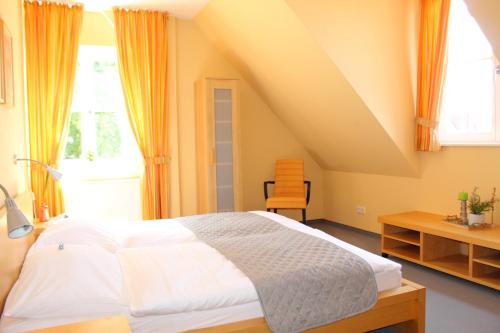 a bedroom with a large bed with an attic at Landgasthof Wildwasser in Wolthausen