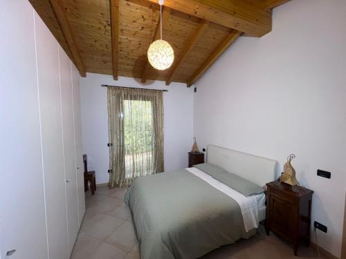 Postel nebo postele na pokoji v ubytování Al Vigneto