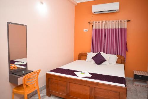 Ένα ή περισσότερα κρεβάτια σε δωμάτιο στο Kristi Guest House, Shantiniketan