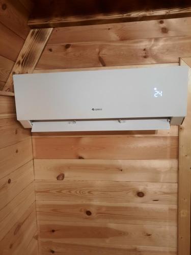 a white stove in a room with wooden floors at The View Smrcevo Brdo in Žabljak