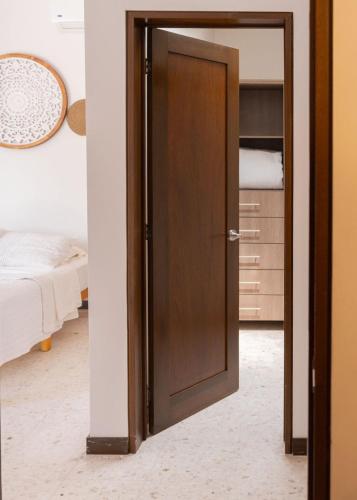 Ένα ή περισσότερα κρεβάτια σε δωμάτιο στο CASA VALPARAISO Suites
