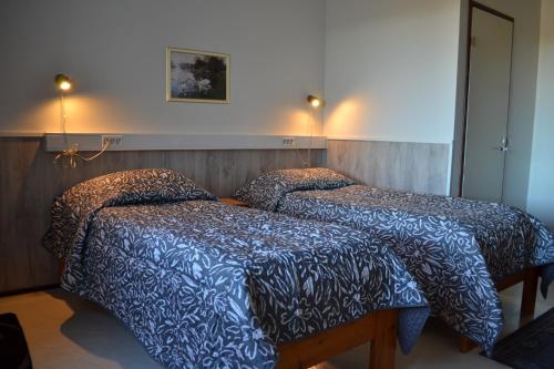 Postel nebo postele na pokoji v ubytování Hotel Takka-Valkea