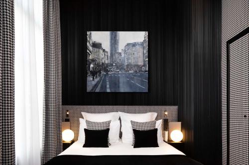 Ένα ή περισσότερα κρεβάτια σε δωμάτιο στο Hotel Pas De Calais