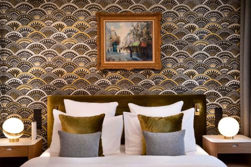 Ένα ή περισσότερα κρεβάτια σε δωμάτιο στο Hotel Pas De Calais