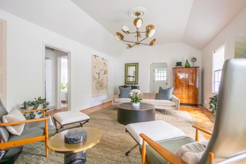 a living room with a couch and a table at Ivy Grace - 4 Br, Stylish, Pet-friendly Retreat in Indianapolis