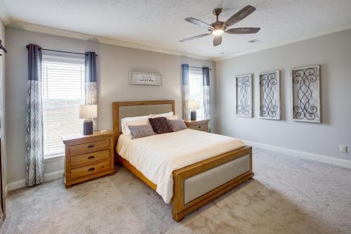 a bedroom with a bed and a ceiling fan at Crossville Home Near Lake Tansi and Hiking Trails! in Crossville