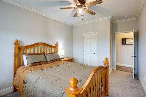 a bedroom with a large bed and a ceiling fan at Crossville Home Near Lake Tansi and Hiking Trails! in Crossville