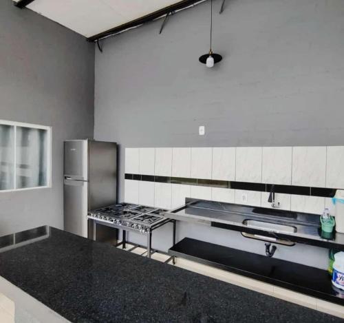 Køkken eller tekøkken på Menino Jesu Área de Lazer