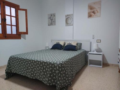 A bed or beds in a room at Casa La Palmera