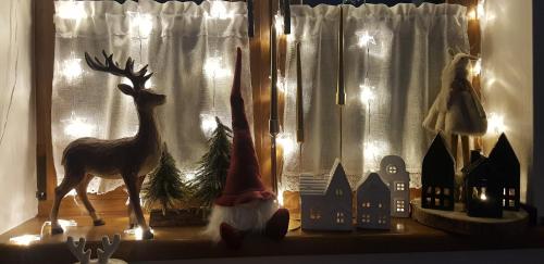 a figurine of a deer standing next to a window at Bieszczadzkie Siedlisko in Polańczyk