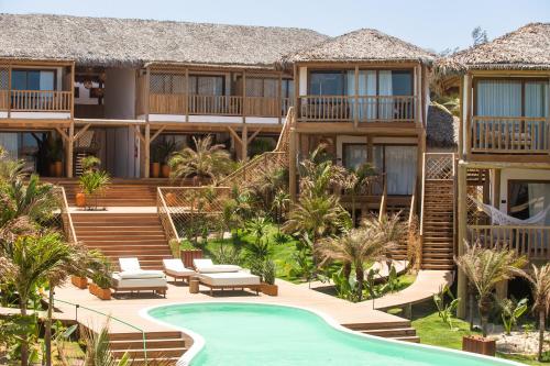 プレアにあるYemanjá Hotel by Preabeach Experienceのスイミングプール付きのリゾートのイメージ
