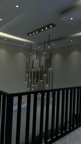 a row of chandeliers hanging from a ceiling at بيت الشرقية in Mazra‘at Shuway‘ī