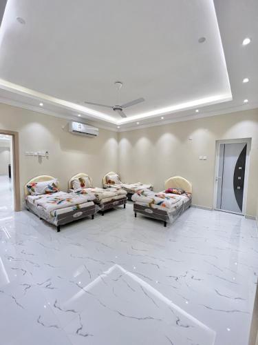 a large room with couches and a marble floor at بيت الشرقية in Mazra‘at Shuway‘ī