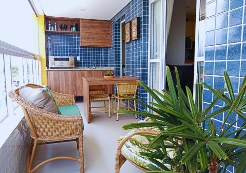 Khu vực ghế ngồi tại Beira Mar, Conforto e Infra de Resort em Bertioga SP