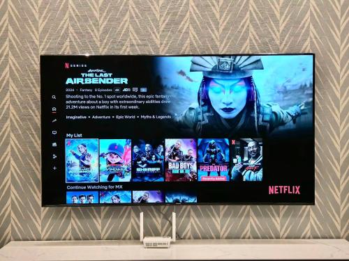 a tv screen with a movie poster on it at R&F Mall Princess Cove 10-12pax Sea View-Smart TV 70inch in Johor Bahru