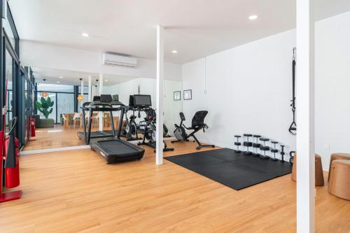 a gym with treadmills and exercise equipment in a room at Metropolitan Living Lisbon - Campolide in Lisbon
