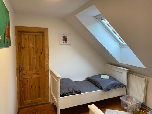 a bedroom with a bunk bed with a window at Do pohody - Do přírody in Stoječín
