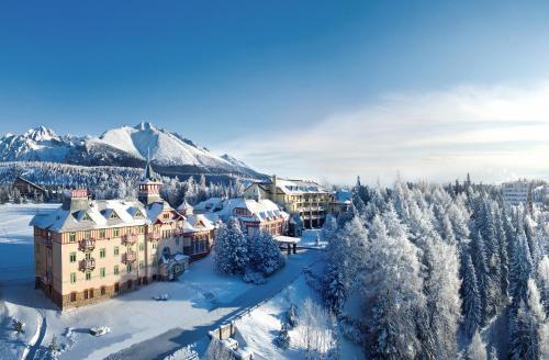 an aerial view of a resort in the snow at Grand Hotel Kempinski High Tatras in Štrbské Pleso
